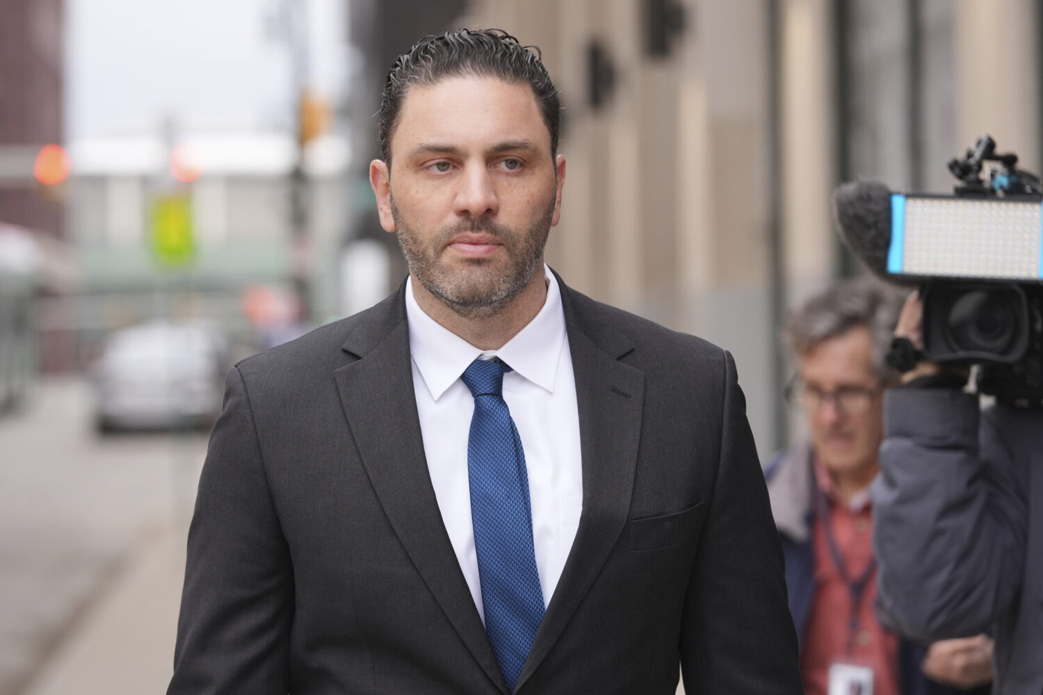 FILE - Former NFL and University of Michigan assistant football coach Matt Weiss leaves federal cou...