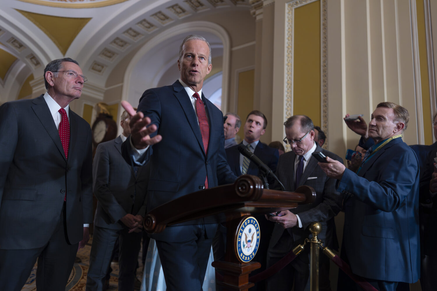 Senate Majority Leader John Thune, R-S.D., center, joined at left by Sen. John Barrasso, R-Wyo., th...