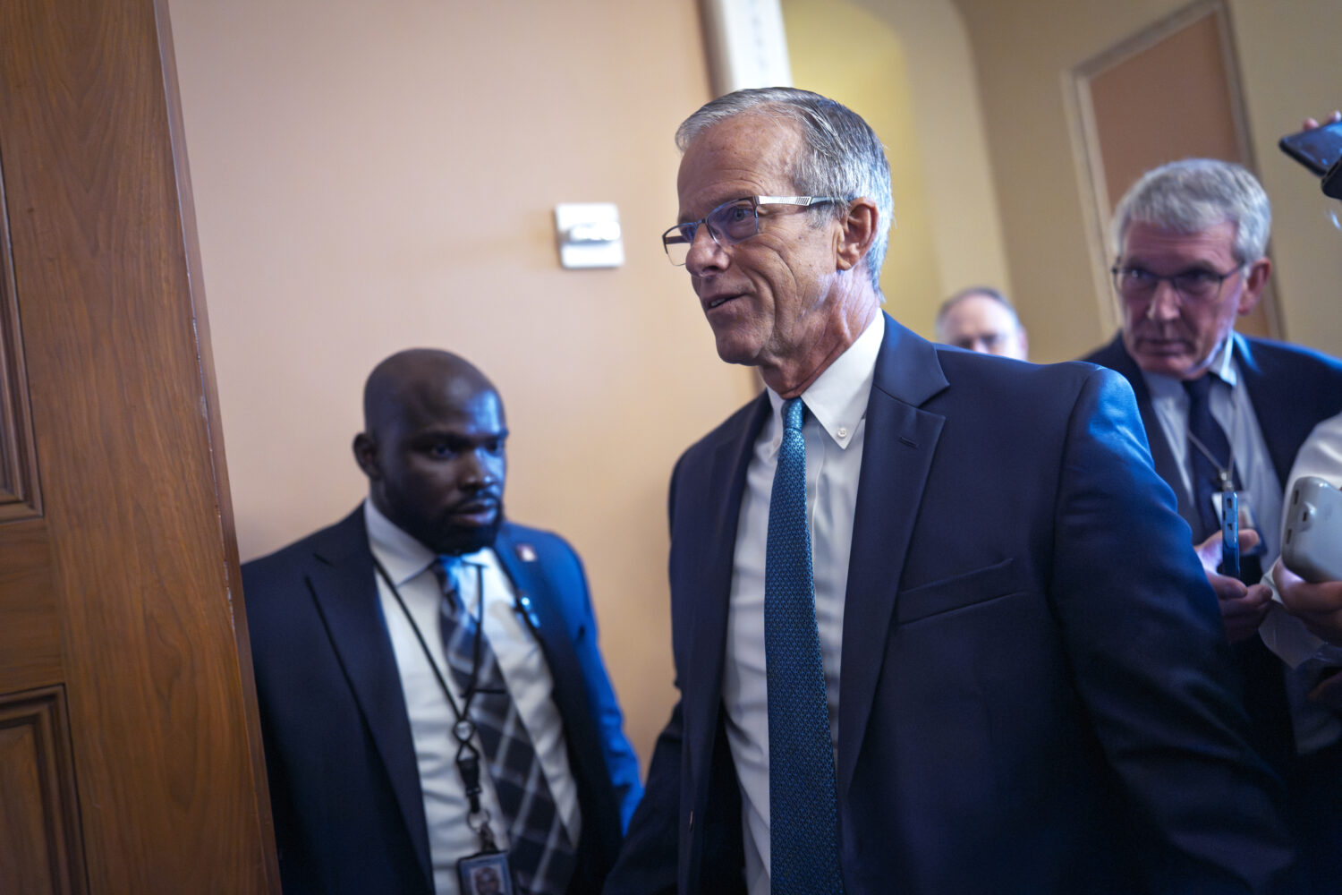 Senate Majority Leader John Thune, R-S.D., arrives for a closed-door Republican meeting to advance ...