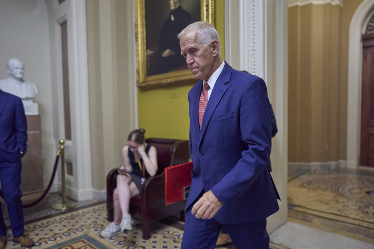 Sen. Thom Tillis, R-N.C., walks to the chamber as senators arrive for votes and policy meetings, at...