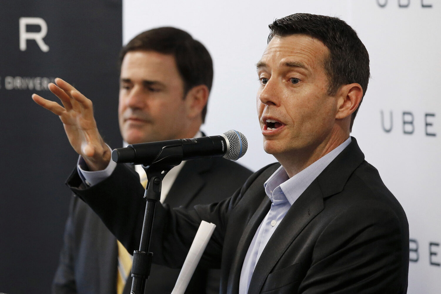 FILE - David Plouffe, right, Uber senior vice president of policy and communications, talks about t...