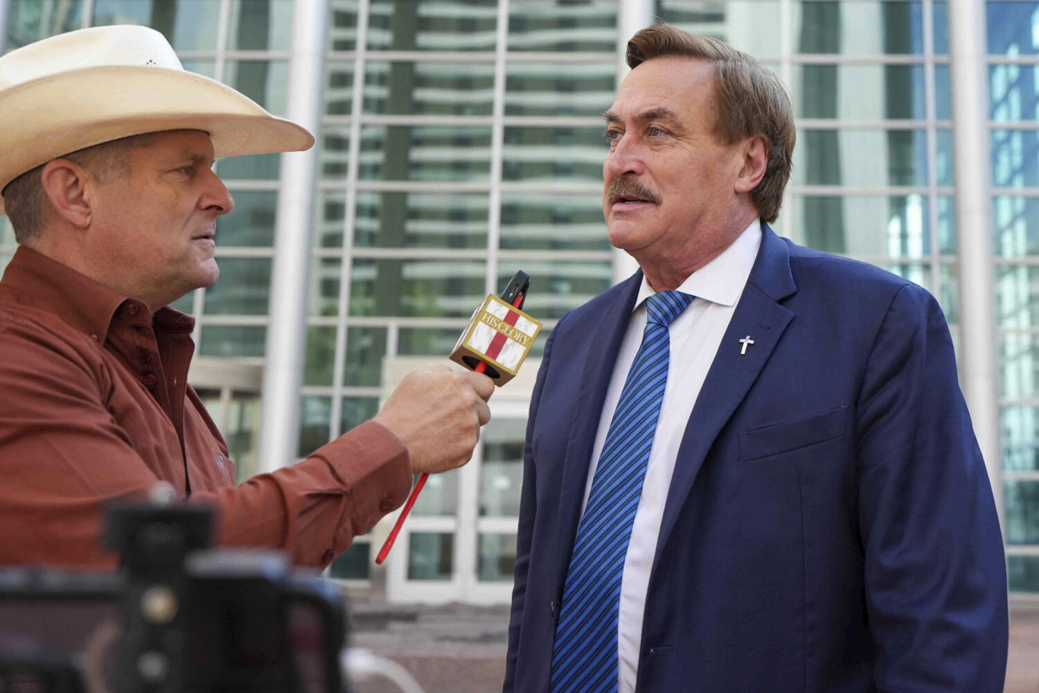 Mike Lindell talks to the media on his way into federal district court for a defamation trial on Th...