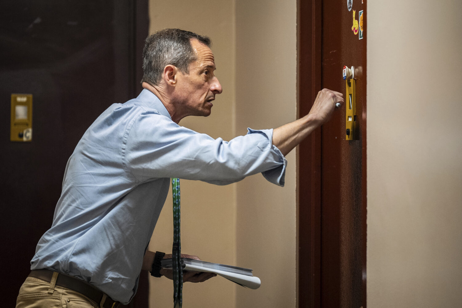 Anthony Weiner knocks on a resident's door while capaigning for a seat on the New York City Council...