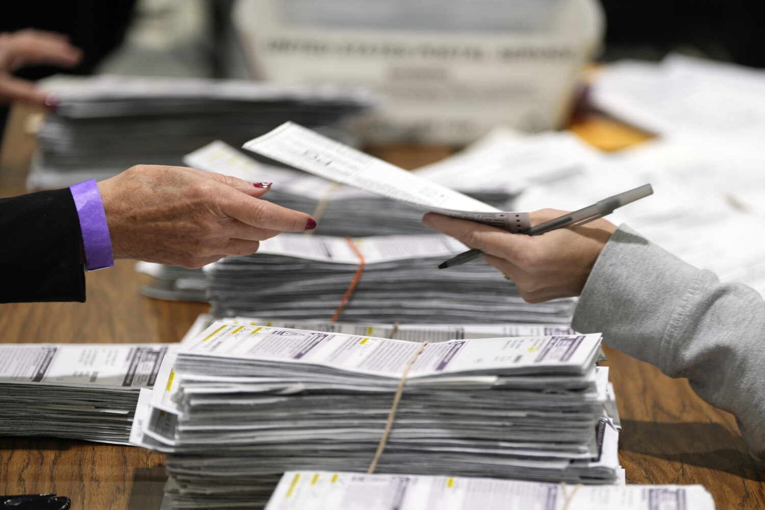 FILE - Election workers process ballots for the 2024 General Election, Nov. 5, 2024, in Milwaukee. ...