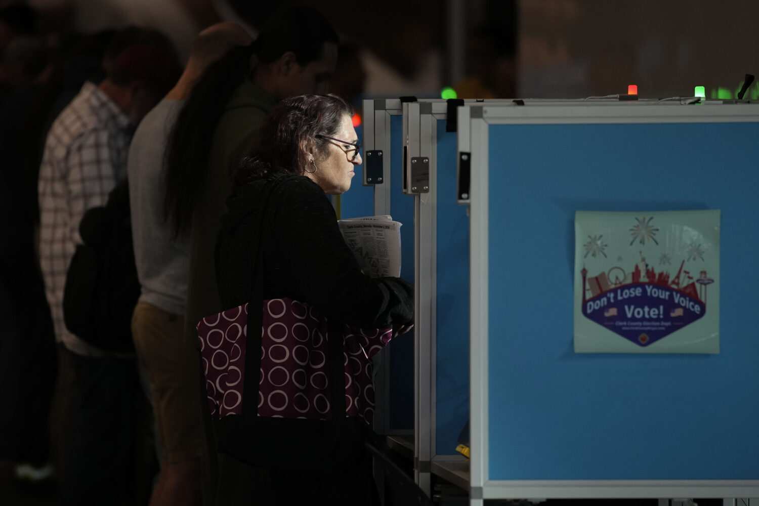 FILE - People vote at the Allegiant Stadium polling place, Nov. 5, 2024, in Las Vegas. (AP Photo/Jo...