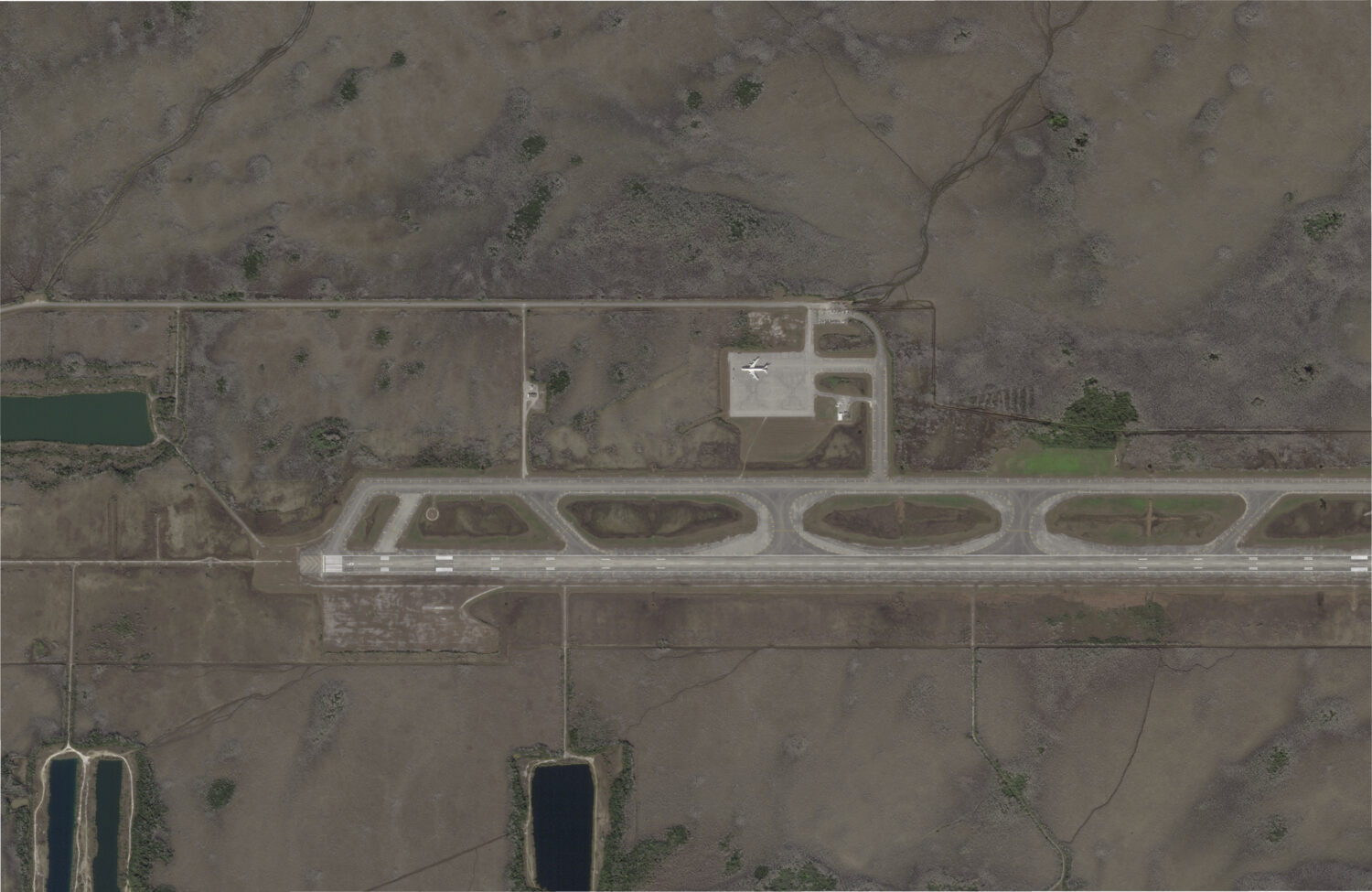 This satellite photo captured by Planet Labs PBC on Feb. 14, 2024, shows an airstrip in Ochopee, Fl...