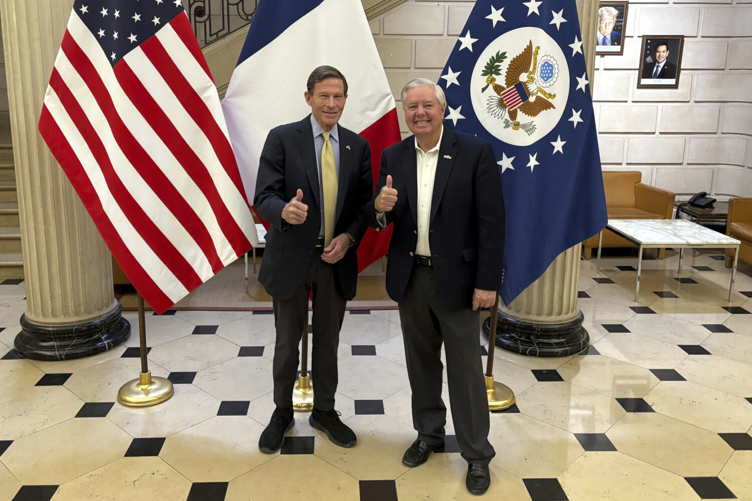 Sen. Richard Blumenthal, D-Conn., left, and Sen. Lindsey Graham, R-S.C thumb up during a news event...