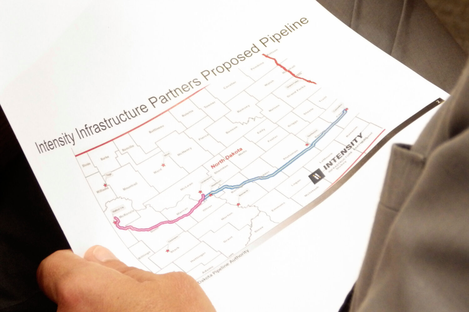 North Dakota Republican Gov. Kelly Armstrong holds a map of a proposed natural gas pipeline on Thur...