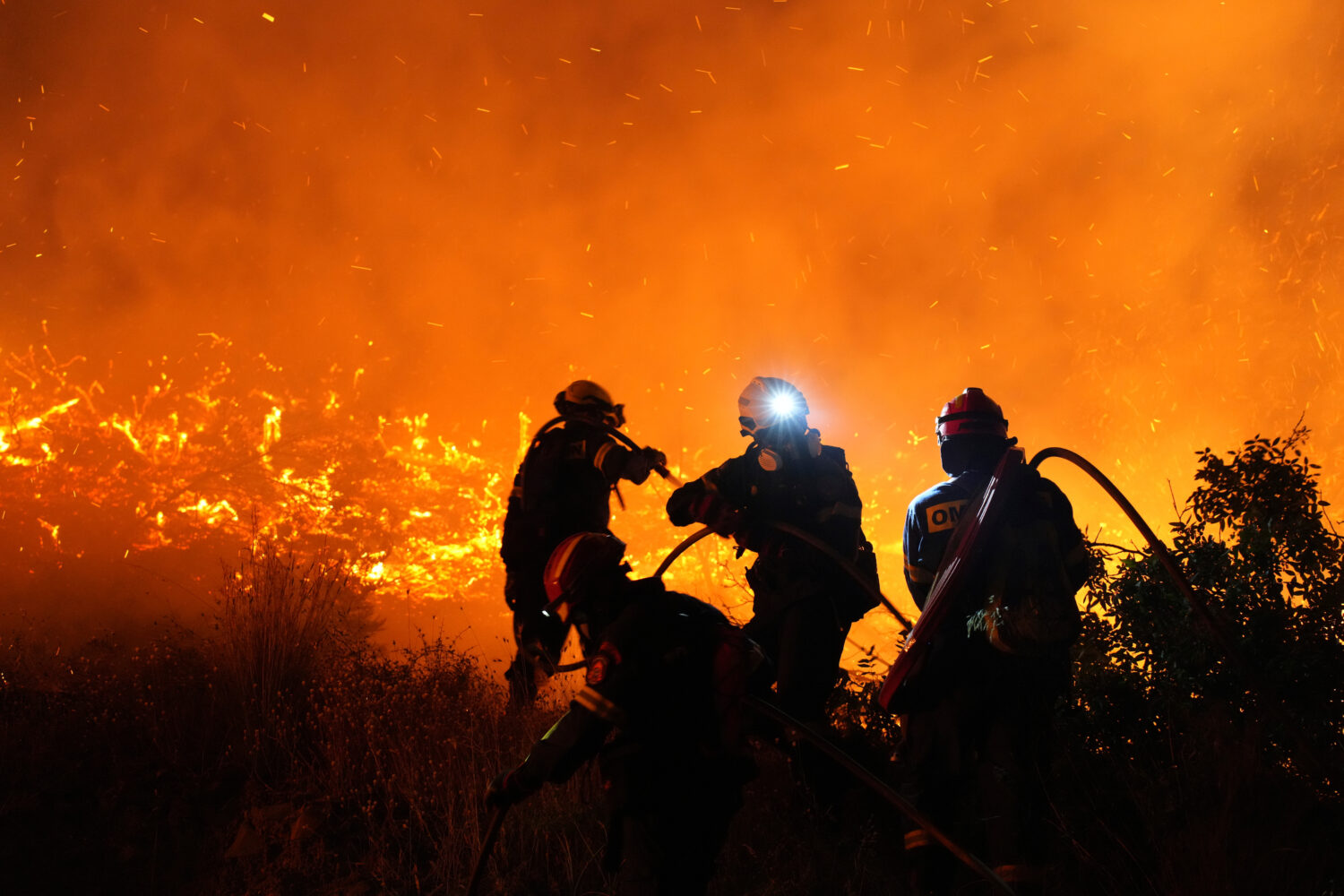 Firefighters battle with a large wildfire burning in Kofinas, on the eastern Aegean island of Chios...