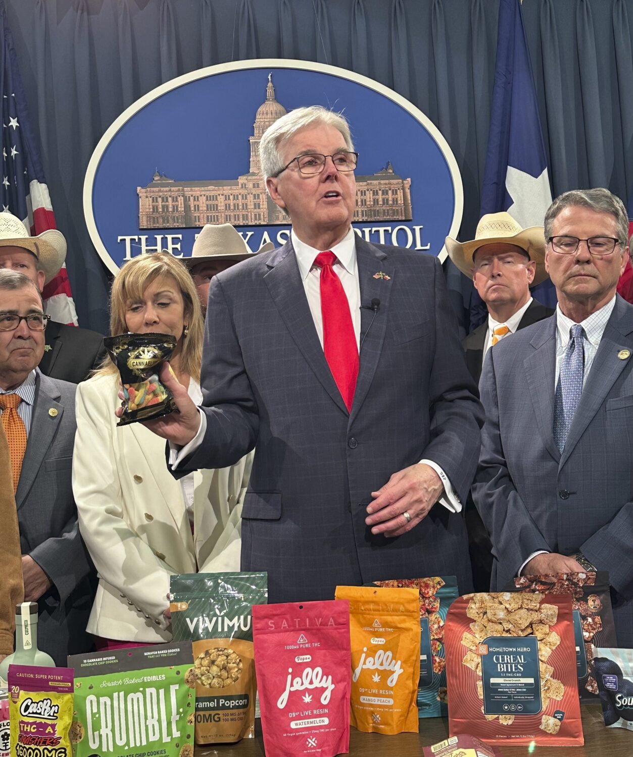 Texas Lt. Gov. Dan Patrick shows products containing THC while calling for a ban on the consumables...