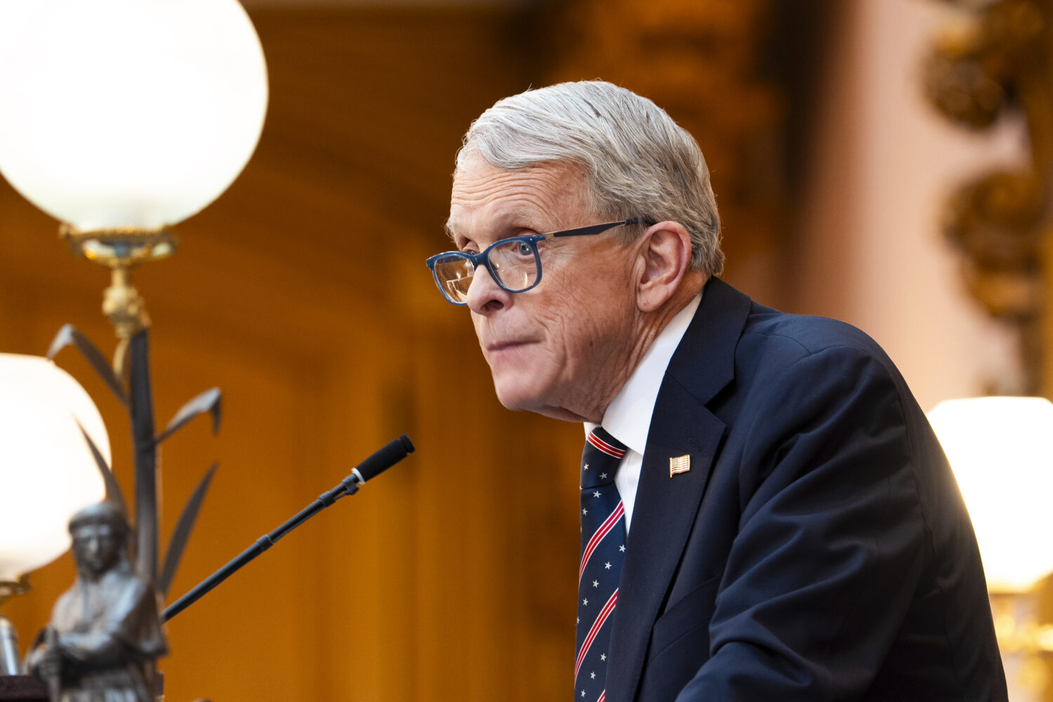 FILE - Ohio Gov. Mike DeWine gives the State of the State address in the Ohio House chambers at the...