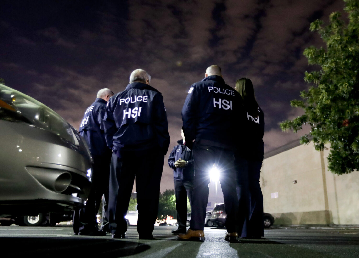 FILE - In this Jan. 10, 2018, file photo, U.S. Immigration and Customs Enforcement agents gather be...