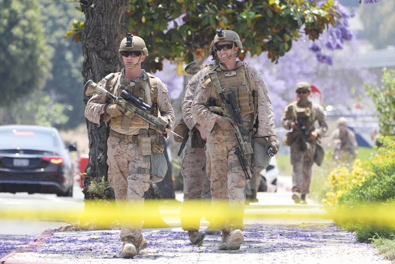 U.S Marines work outside of a federal building, Friday, June 13, 2025, in Los Angeles (AP Photo/Dam...