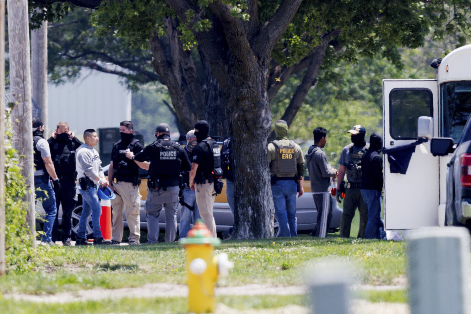 Federal agents are seen near Glenn Valley Foods in Omaha, Neb., Tuesday, June 10, 2025. (Nikos Fraz...