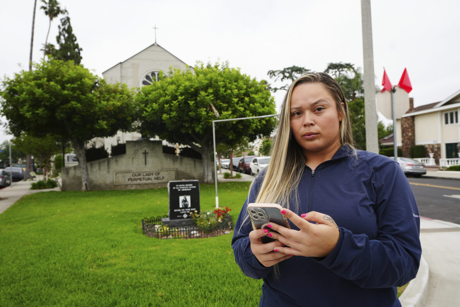 Melyssa Rivas poses for a photo at a location where she witnessed masked federal agents detaining a...
