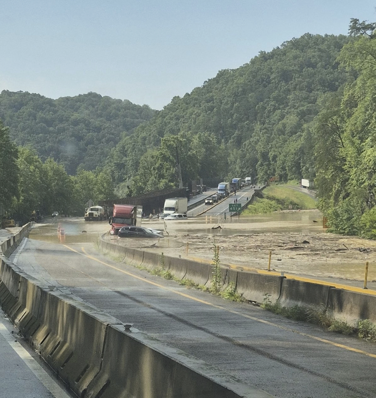 This photo provided by Tennessee Department of Transportation shows Interstate 40 remains closed ne...