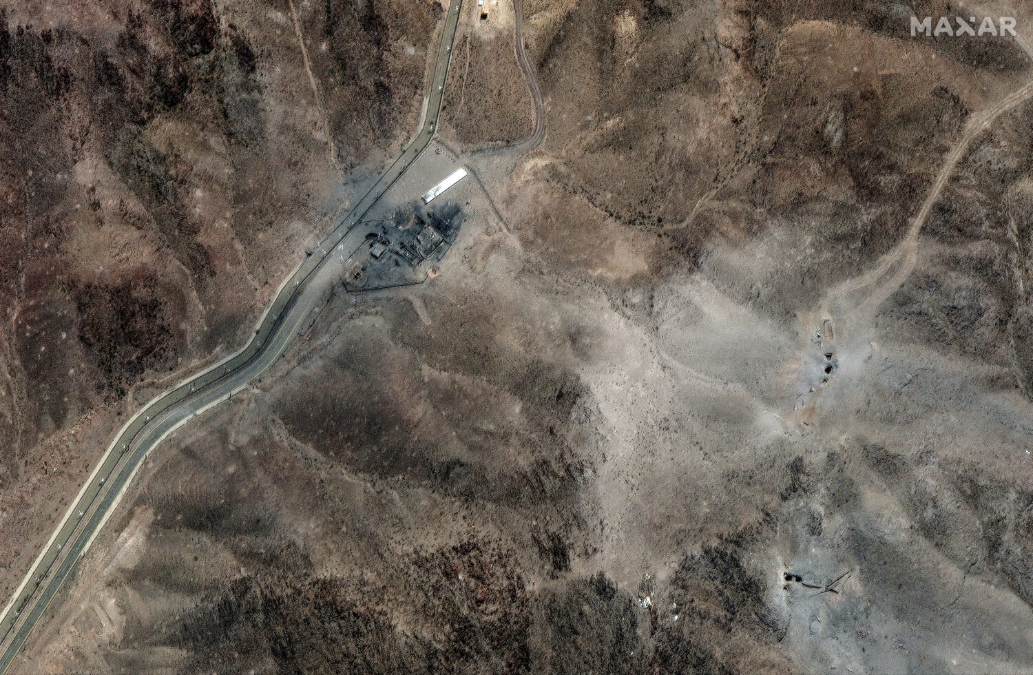 This Tuesday, June 24, 2025, satellite image provided by Maxar Technologies shows damage at Fordo e...