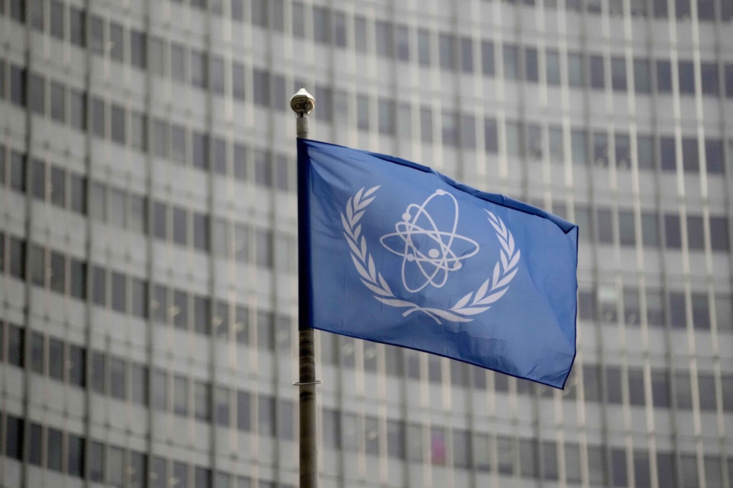FILE - The flag of the International Atomic Energy Agency flies in front of its headquarters during...