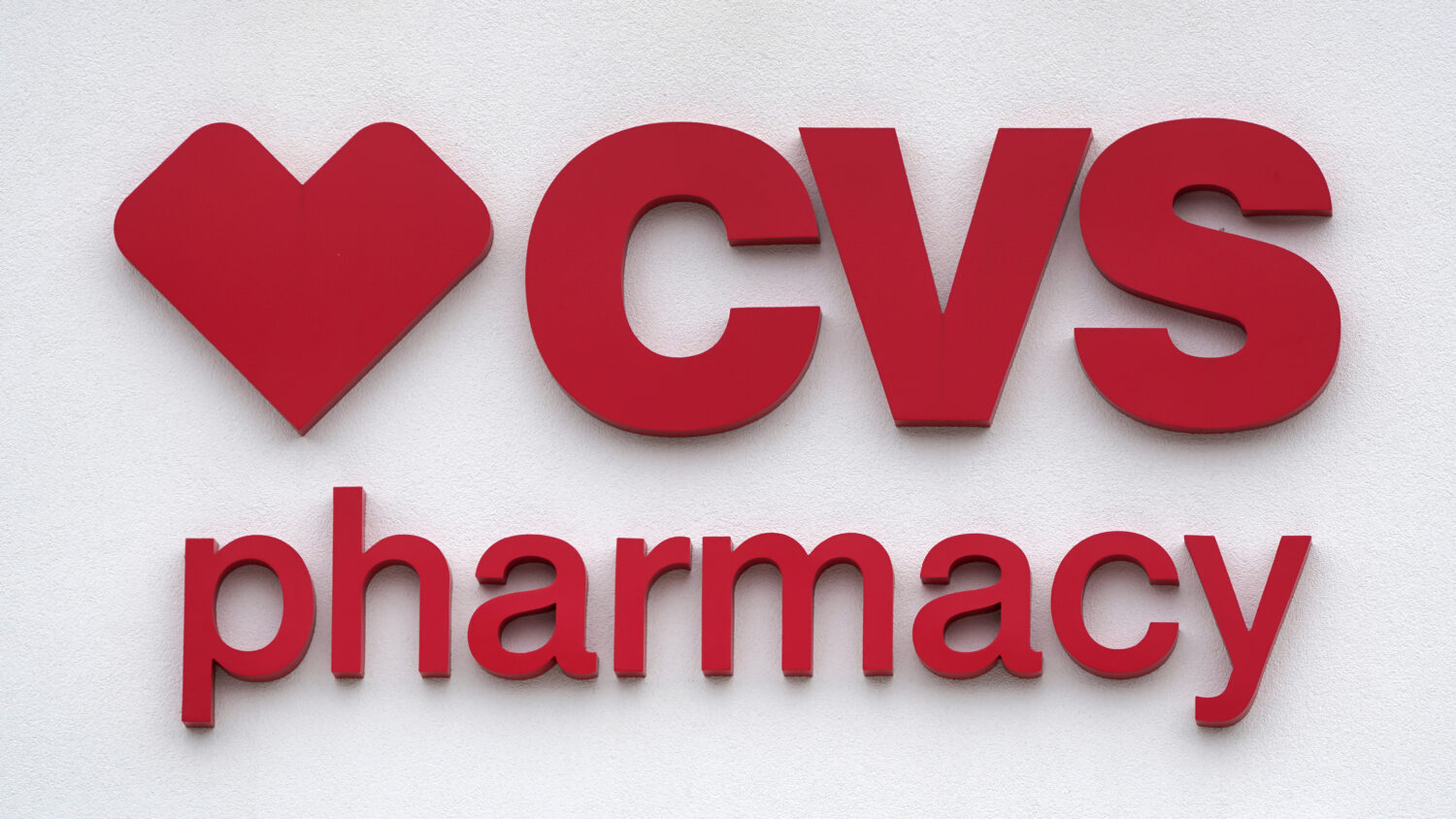 FILE - The CVS Pharmacy logo is displayed on a store on Aug. 3, 2021, in Woburn, Mass. (AP Photo/Ch...