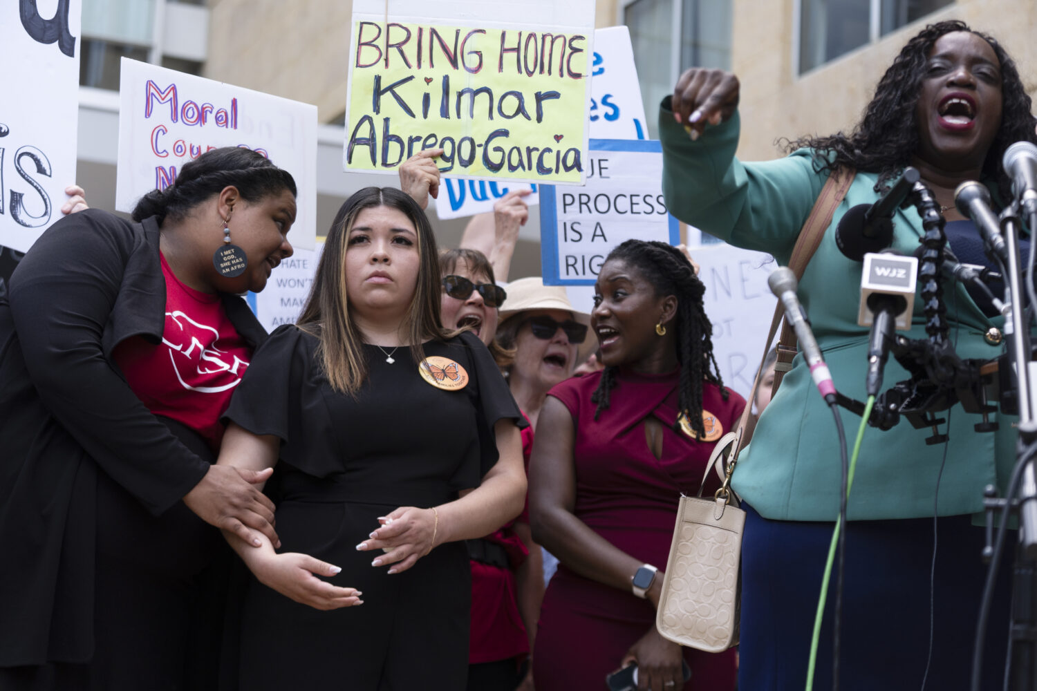 Wife of Kilmar Abrego Garcia, Jennifer Vasquez Sura, second from left, joins a rally outside the U....