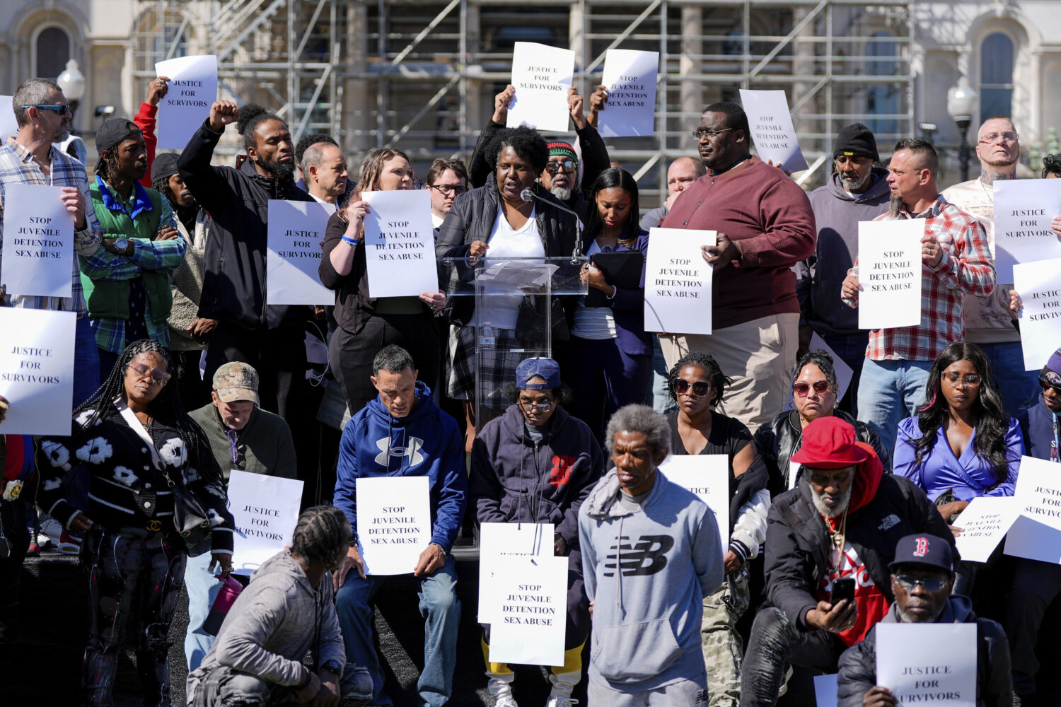FILE - Nalisha Gibbs, center top, speaks during a press conference among other survivors of sexual ...