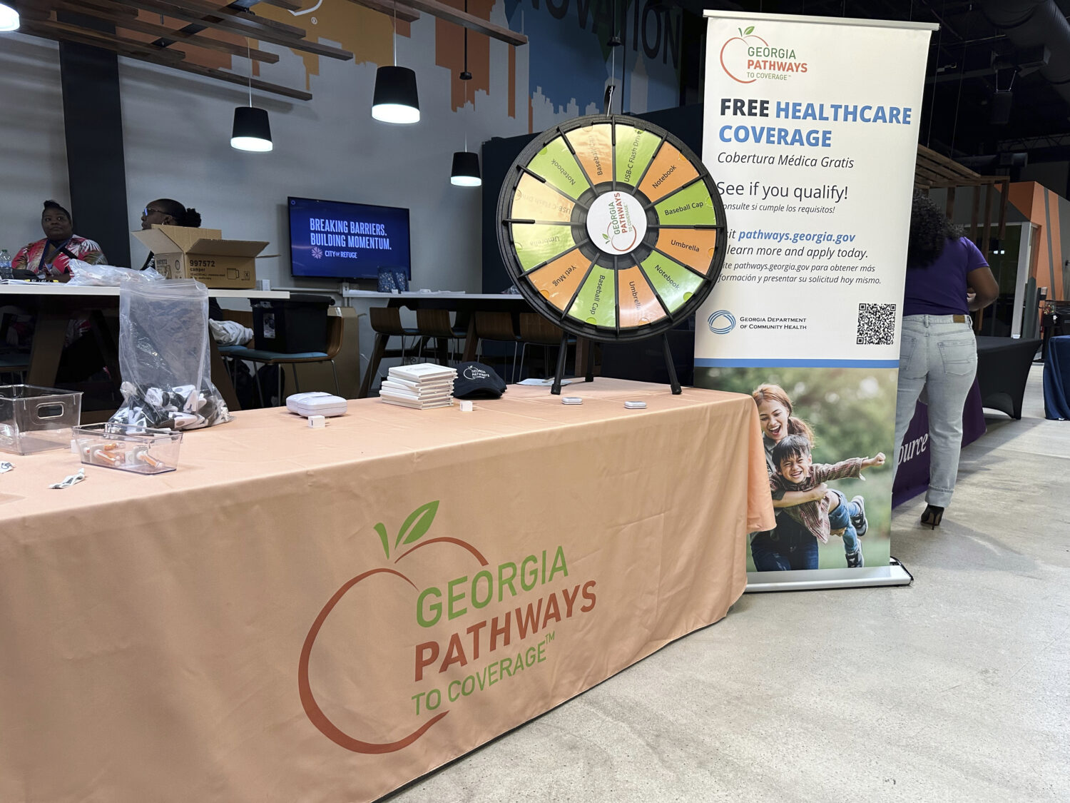 FILE - A stand for Georgia Pathways is seen at a job fair in Atlanta, Ga., June 5, 2025. (AP Photo/...