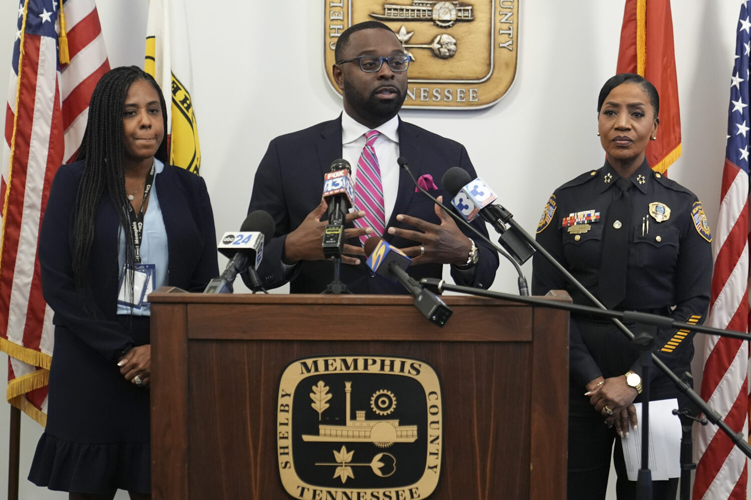 FILE - Mayor Paul Young, center, speaks during a news conference with Tannera Gibson, left, and Pol...