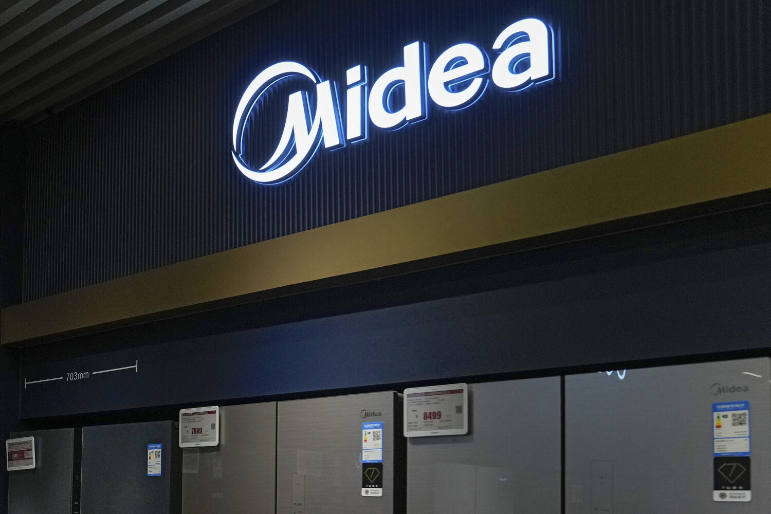 FILE - Midea's fridges are seen at an electronic shop in Beijing on Nov. 15, 2021. (AP Photo/Andy W...