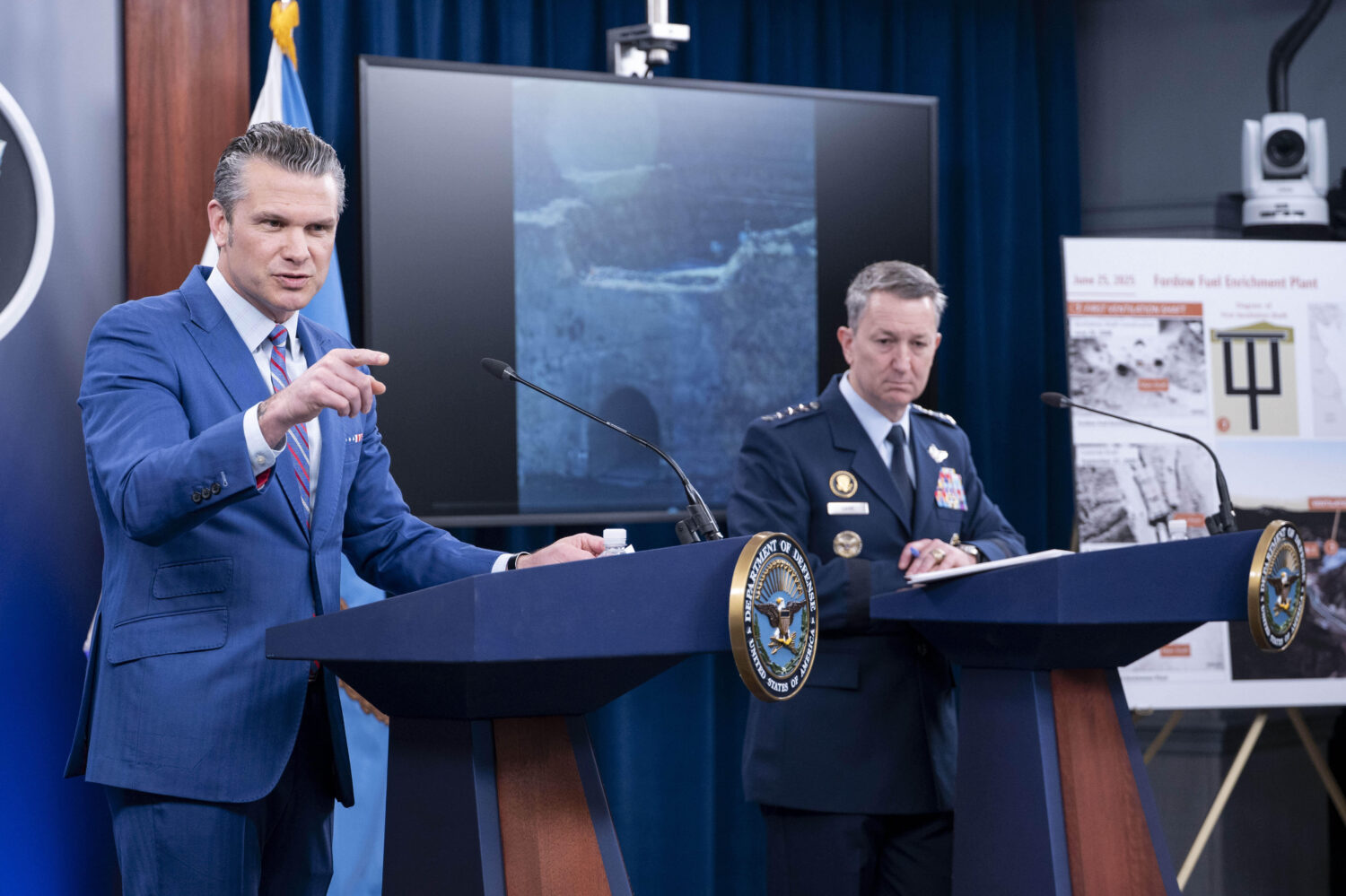 Defense Secretary Pete Hegseth, left, speaks at a news conference with Joint Chiefs Chairman Gen. D...