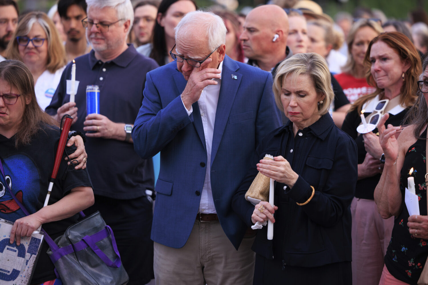 Minnesota Gov. Tim Walz and his wife Gwen Walz attend a candlelight vigil for former House Speaker ...