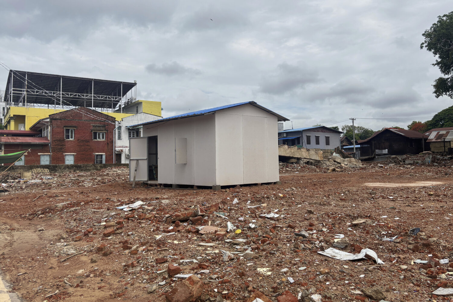 A temporary building is seen after clear collapsed building caused by strong earthquake in Naypyita...