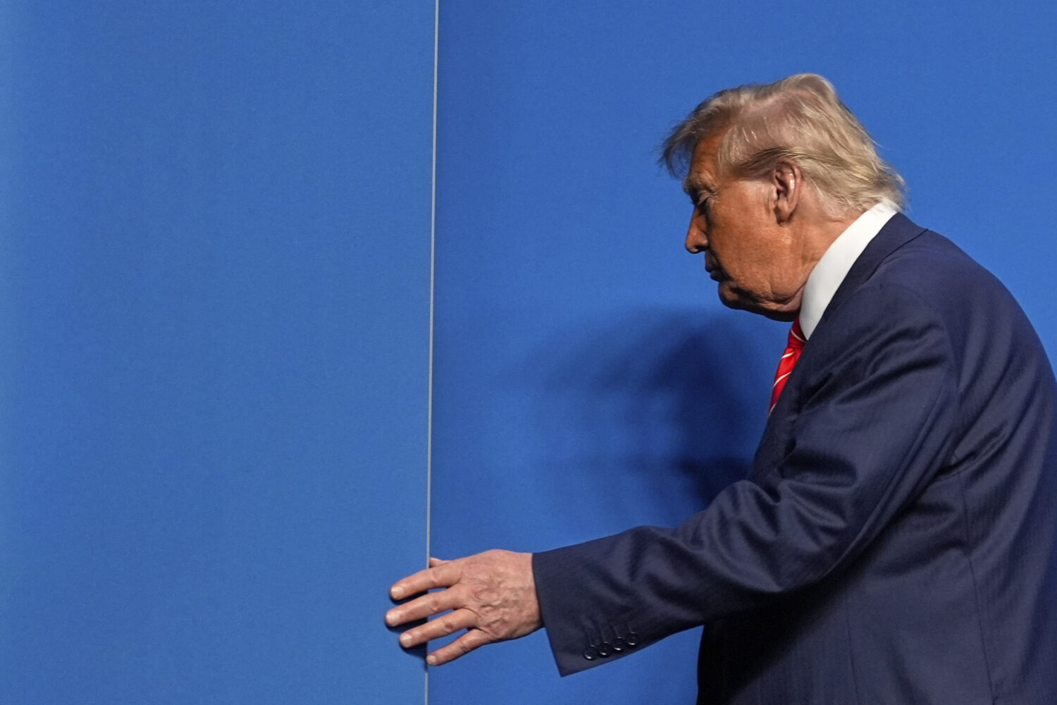 President Donald Trump leaves after a media conference at the end of the NATO summit in The Hague, ...