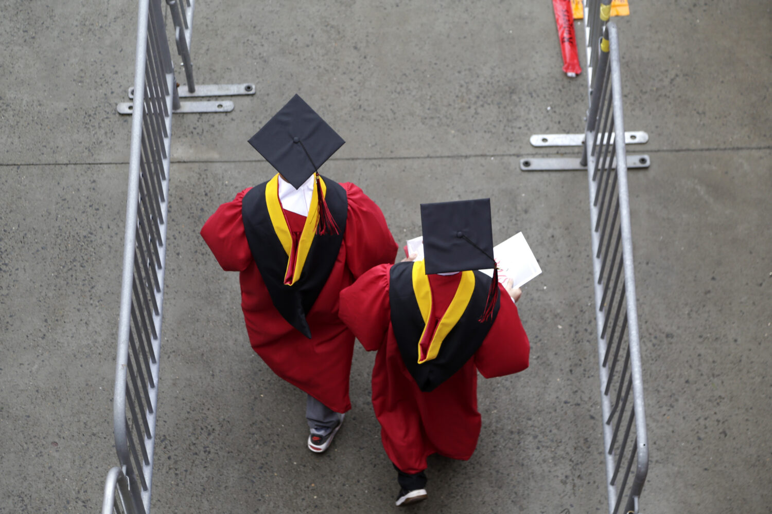FILE - Graduates walk into the High Point Solutions Stadium before the start of the Rutgers Univers...