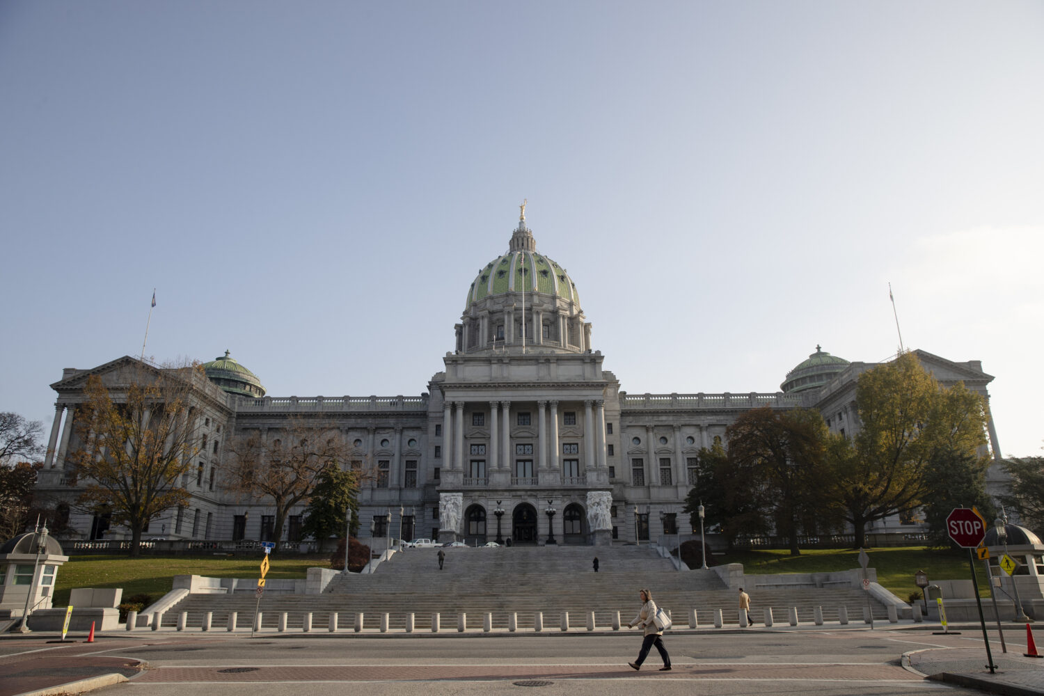 FILE - A pedestrian passes the Pennsylvania Capitol in Harrisburg, Pa., Nov. 19, 2019. (AP Photo/Ma...