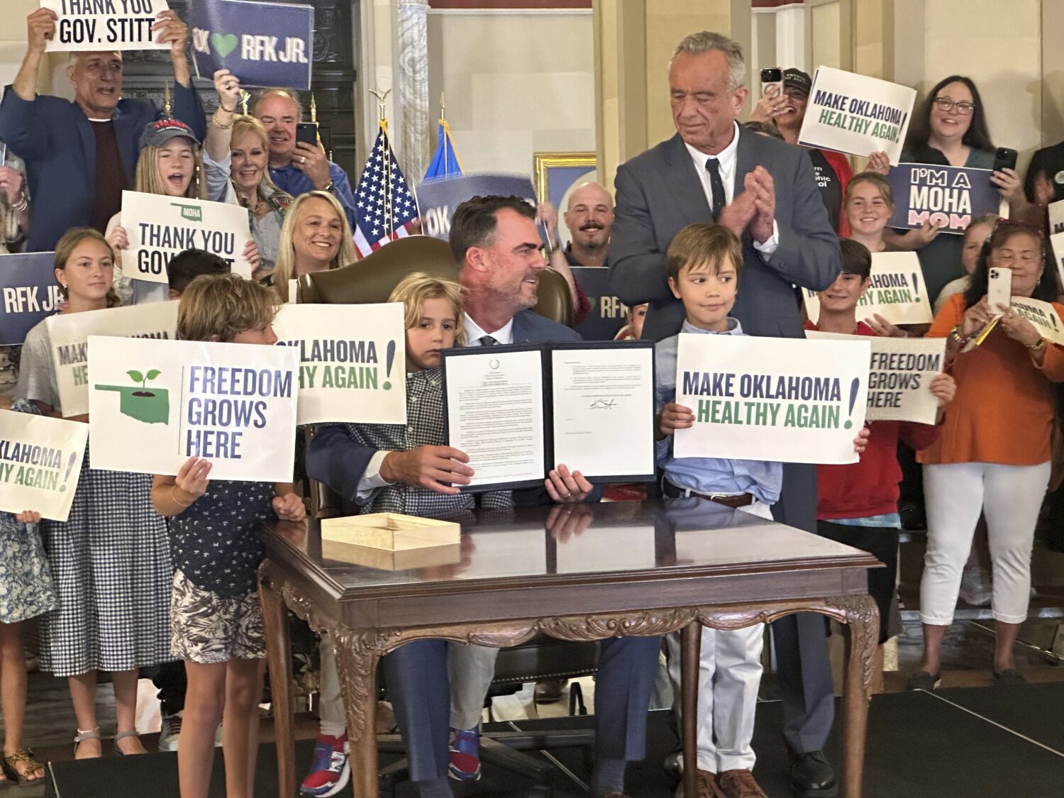 U.S. Secretary of Health and Human Services Robert F. Kennedy Jr. applauds after Oklahoma Gov. Kevi...