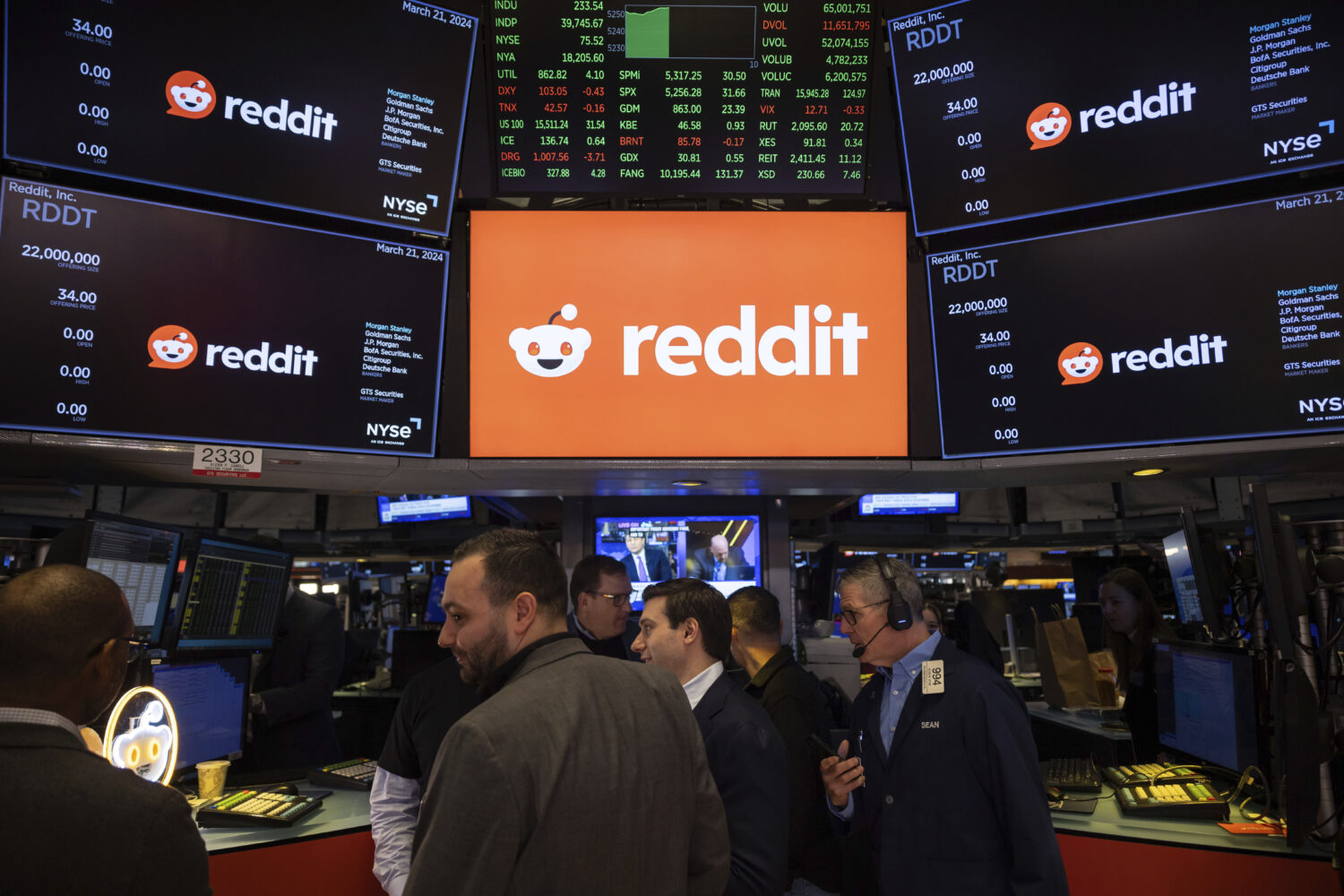 FILE - Reddit Inc. signage is seen on the New York Stock Exchange trading floor, prior to Reddit IP...