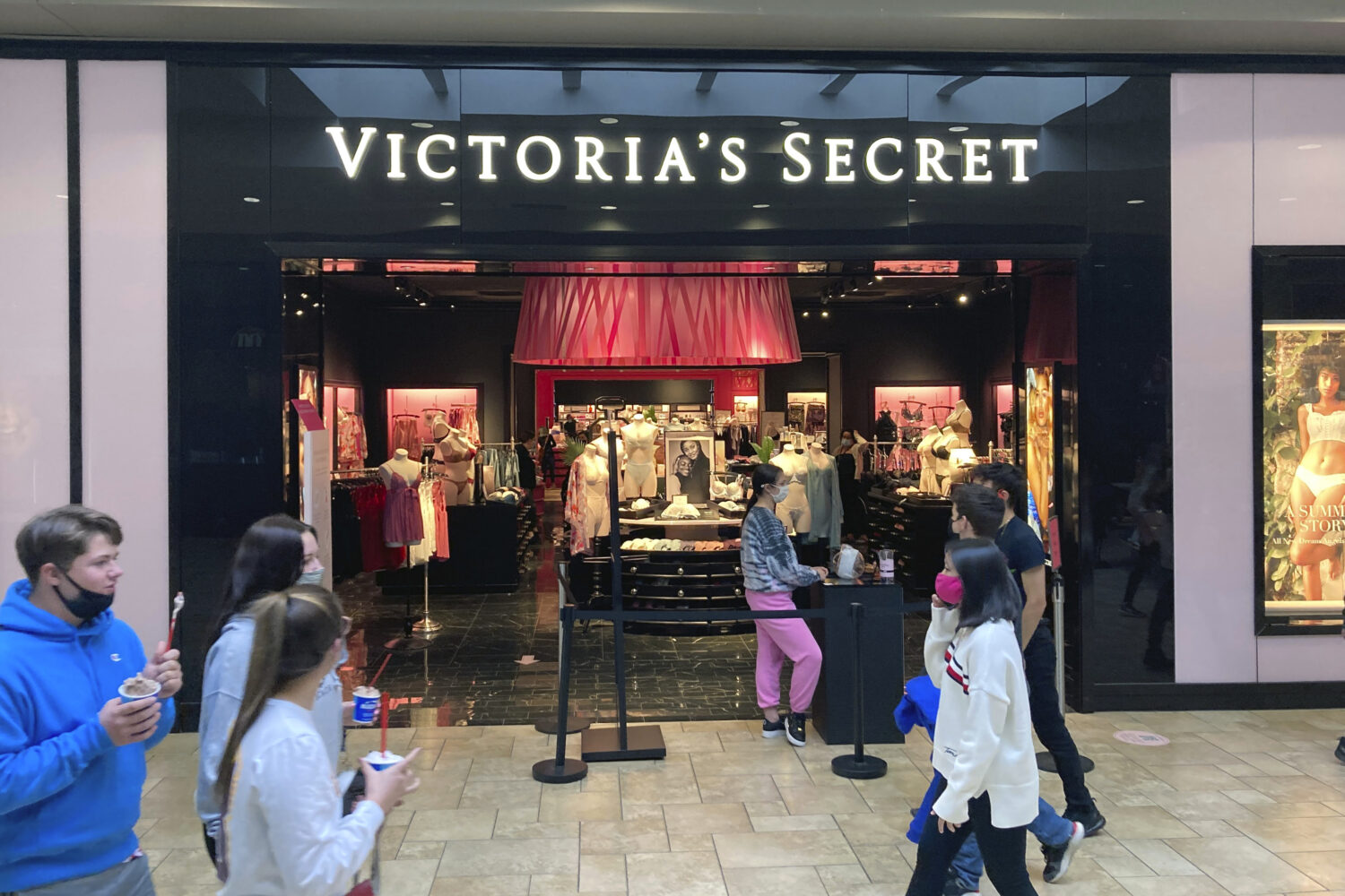 FILE - Shoppers pass a Victoria's Secret store at a shopping mall in Scranton, Pa., May 3, 2021. (A...