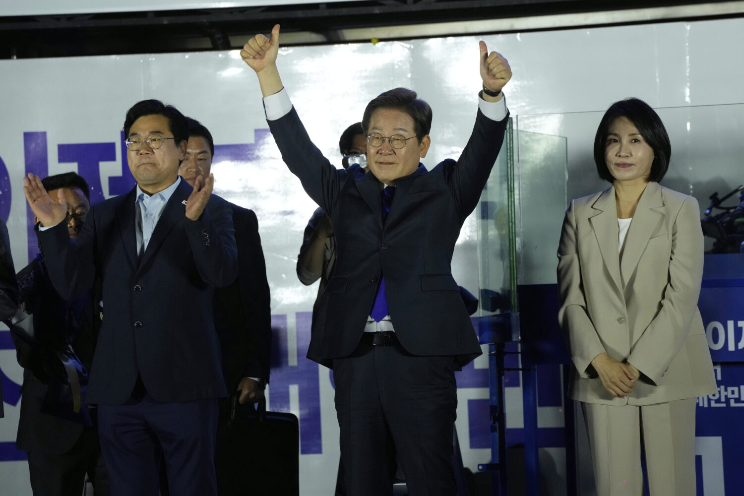 South Korea's Democratic Party's presidential candidate Lee Jae-myung, center, and his wife Kim Hea...