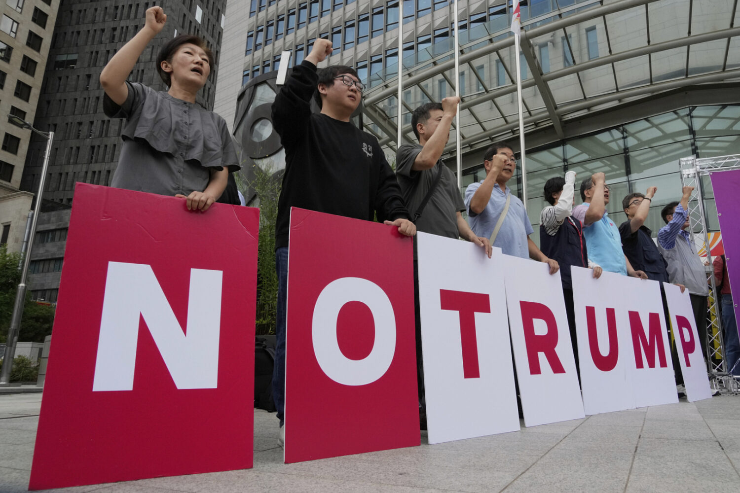 Members of civic groups stage a rally against U.S. President Donald Trump's tariffs policy in Seoul...