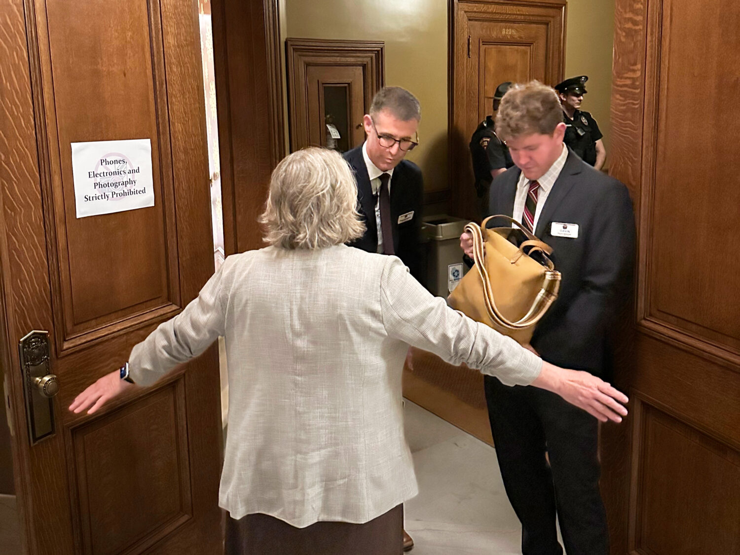 Staff search visitors entering the Wisconsin Senate gallery in the state Capitol just days after th...