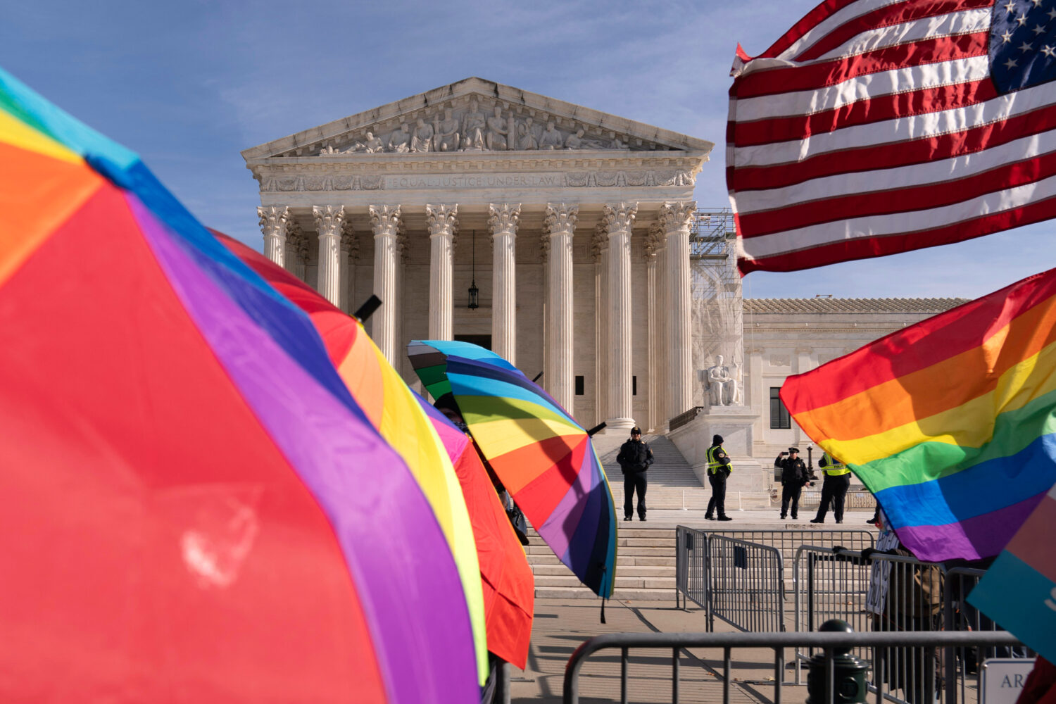 FILE - Transgenders rights supporters rally outside of the Supreme Court, Dec. 4, 2024, in Washingt...