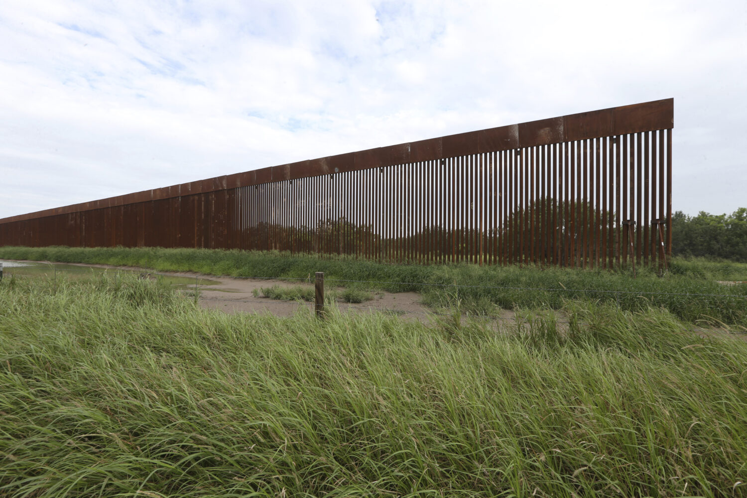 FILE - A border wall section stands on July 14, 2021, near La Grulla, Texas, in Starr County. (Delc...