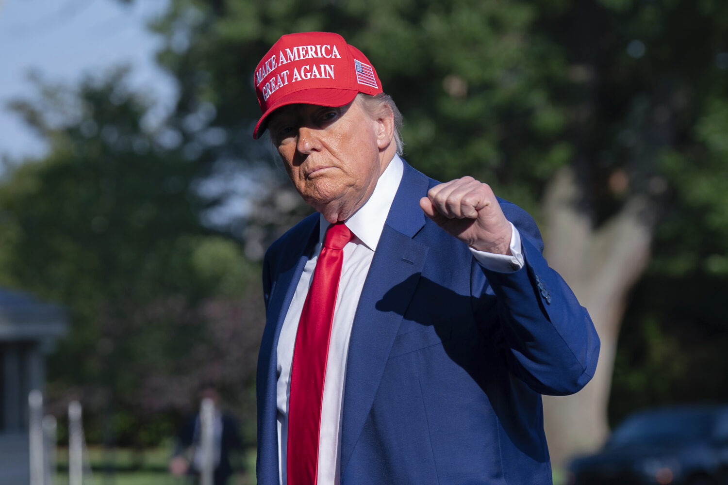President Donald Trump walks on the South Lawn upon arriving at the White House, Saturday, June 21,...