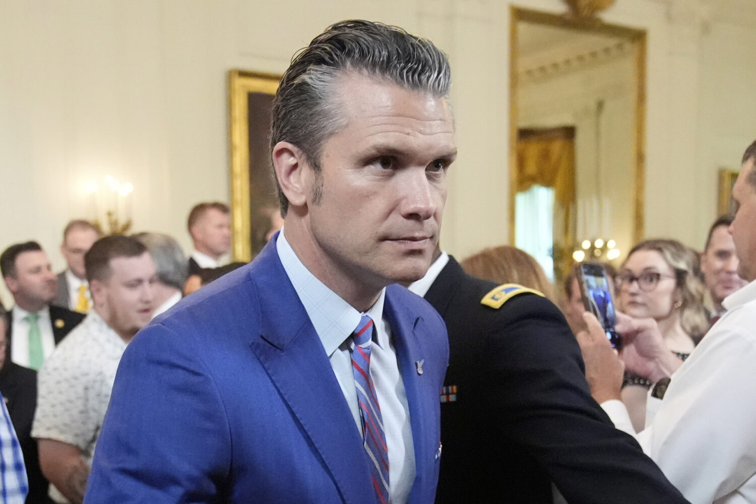 Defense Secretary Pete Hegseth departs an event to promote President Donald Trump's domestic policy...