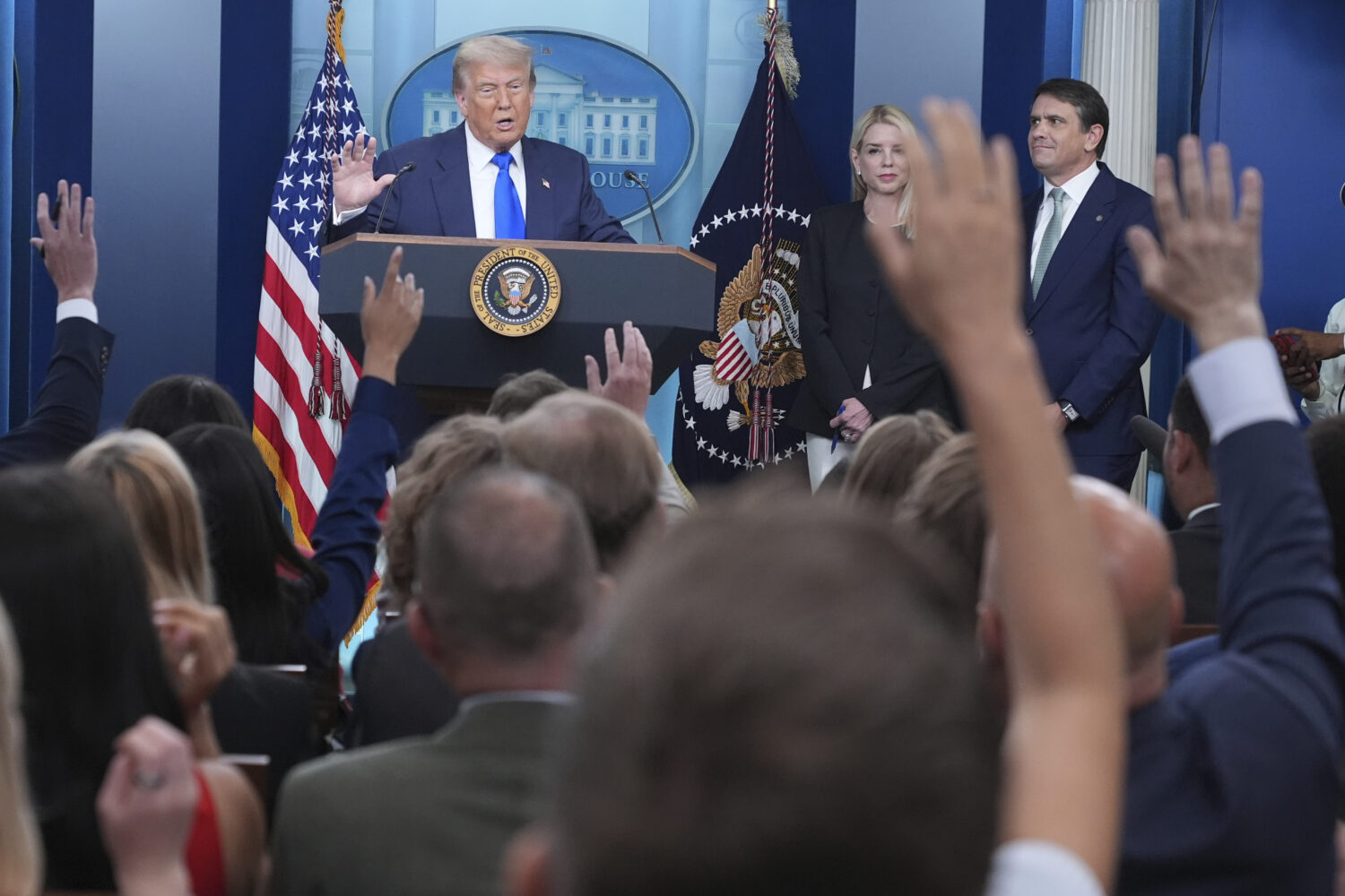 President Donald Trump, from left, speaks to the media as Attorney General Pam Bondi and Deputy Att...