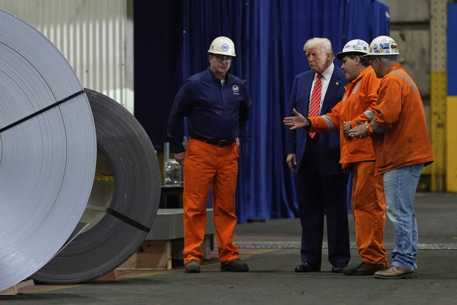 President Donald Trump talks to workers as he tours U.S. Steel Corporation's Mon Valley Works-Irvin...