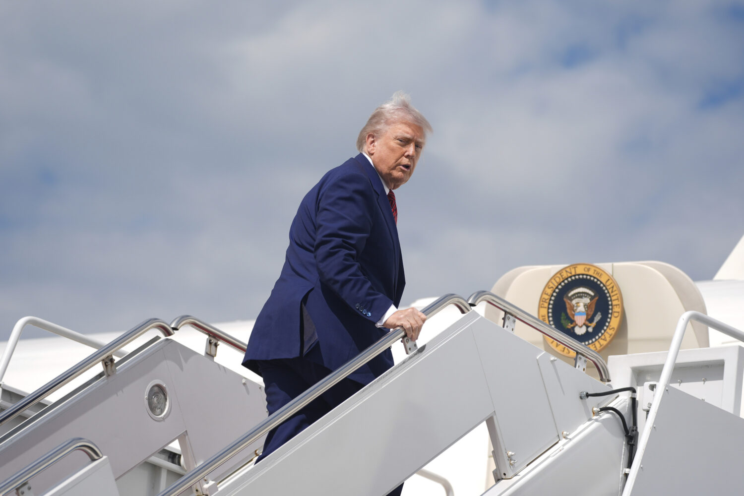 President Donald Trump boards Air Force One to depart Joint Base Andrews, Md., Friday, May 23, 2025...