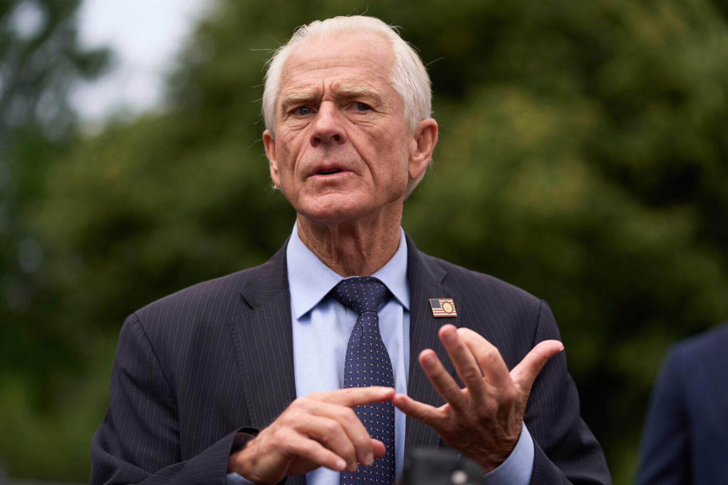 White House trade counselor Peter Navarro speaks with reporters at the White House, Thursday, May 2...
