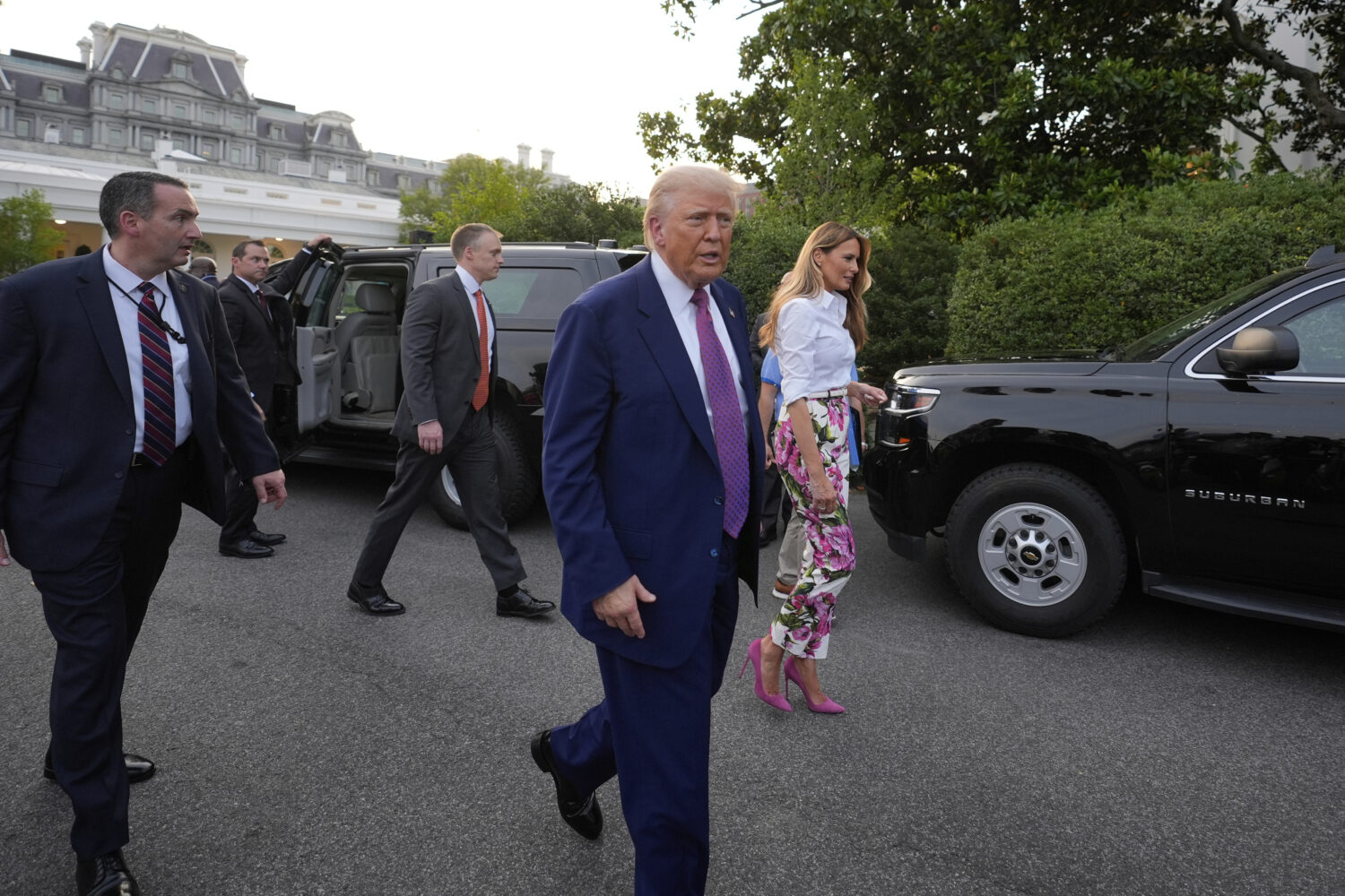 President Donald Trump and first lady Melania Trump walk after greeting guests during the congressi...