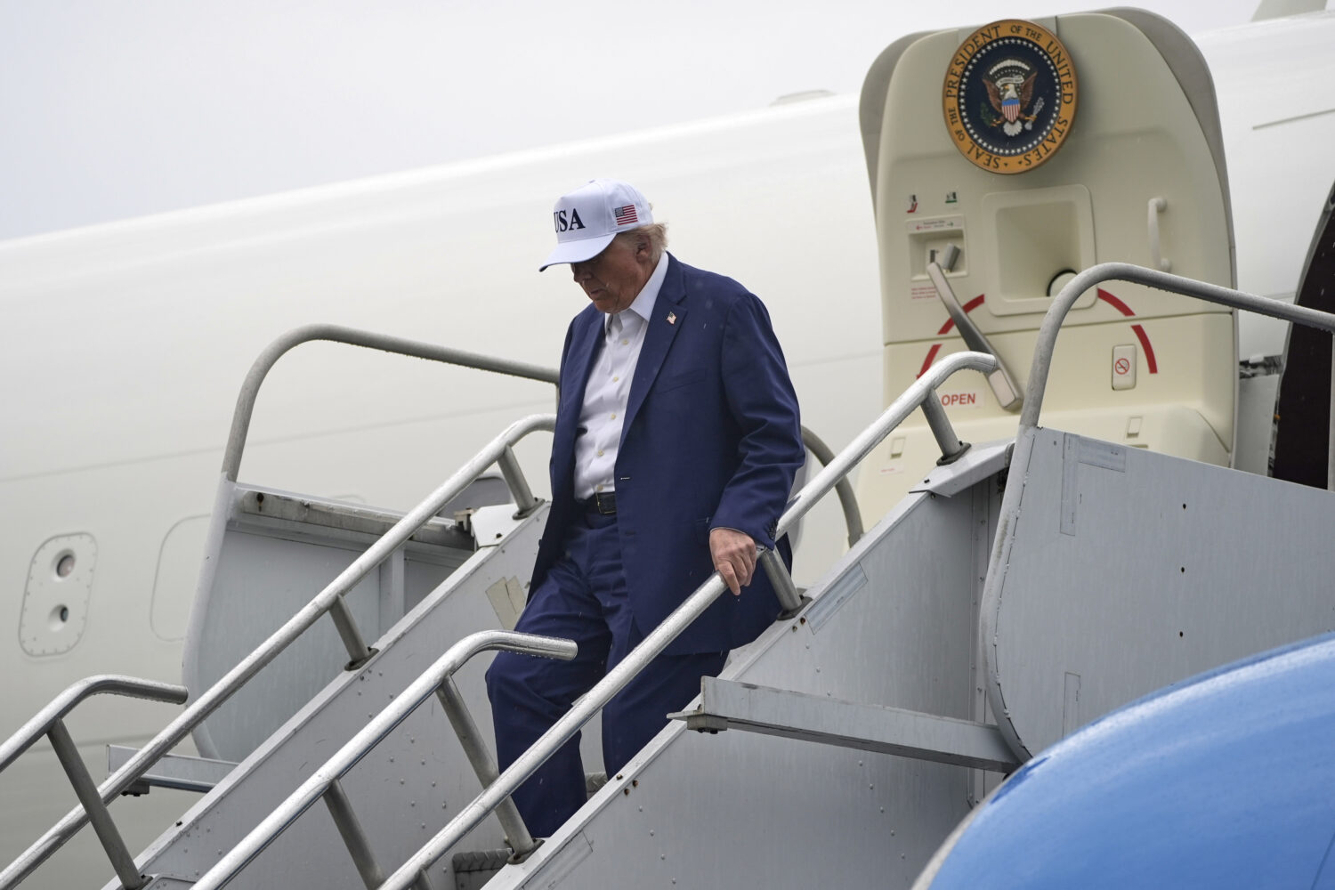 President Donald Trump arrives on Air Force One at Morristown Municipal Airport in Morristown, N.J....